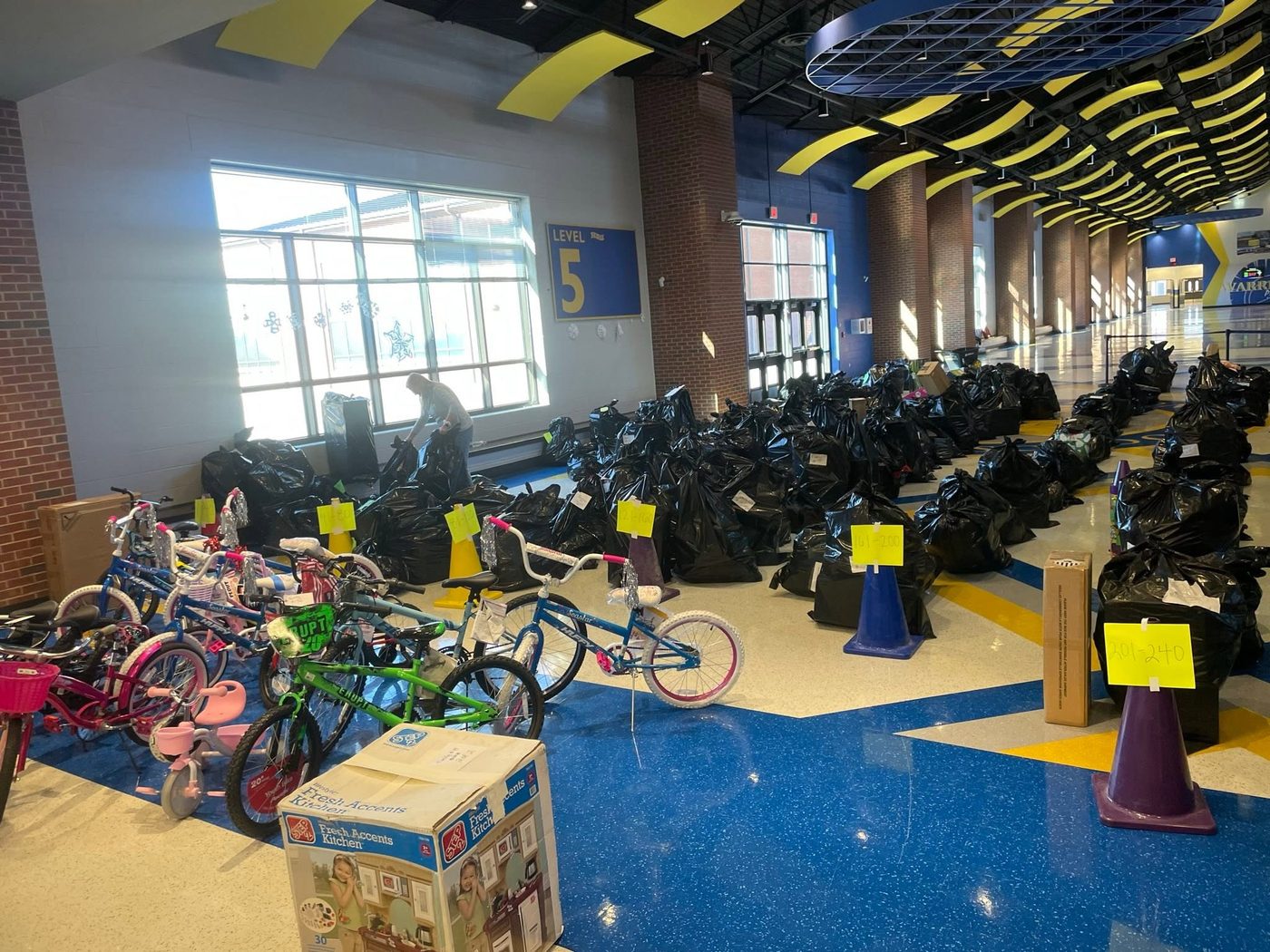 Rows of gift bags and bikes ready for families on pickup day