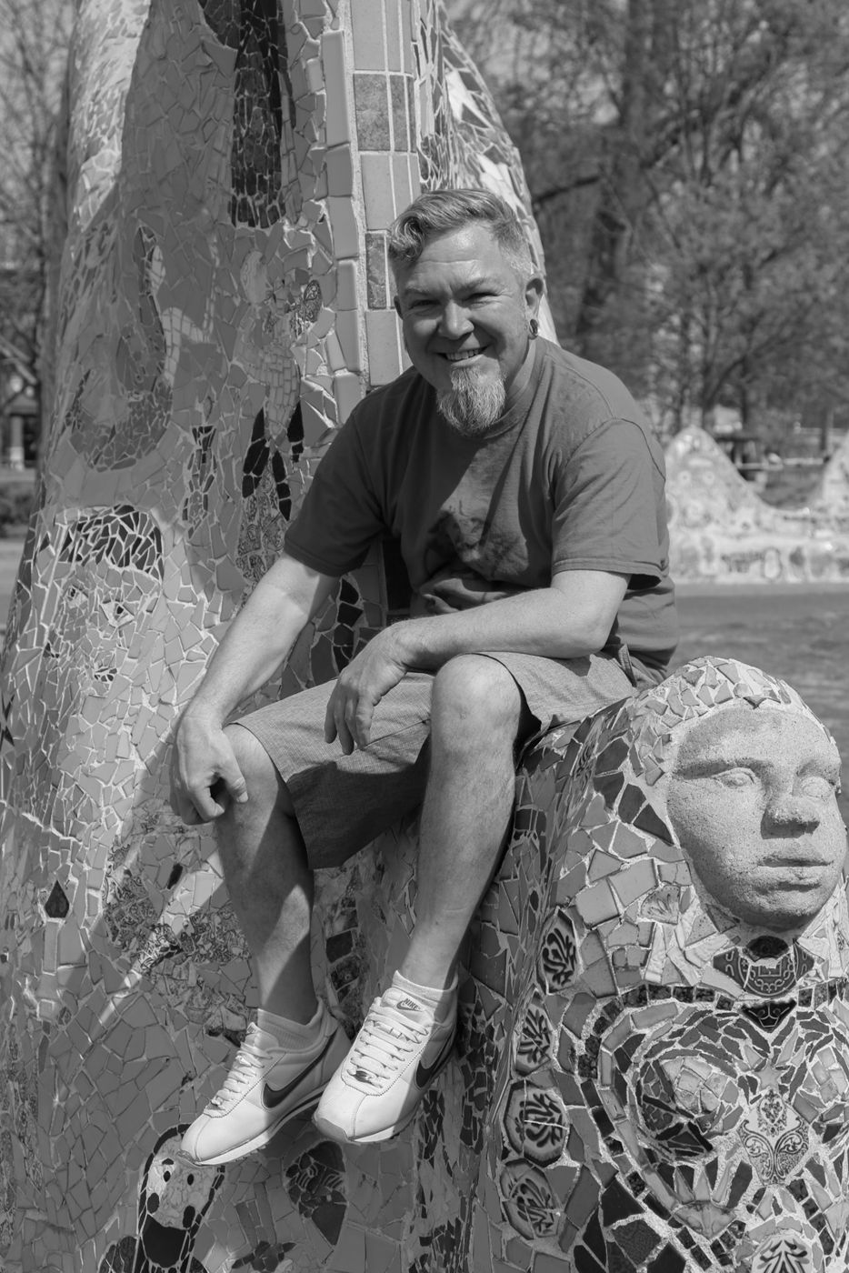 Mighty Rock smiling on a mosaic sculpture